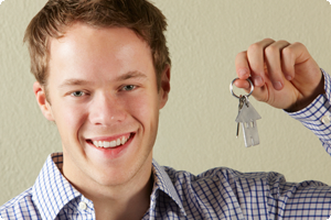 Young man holding keys