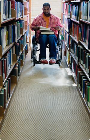 Man in wheelchair in library